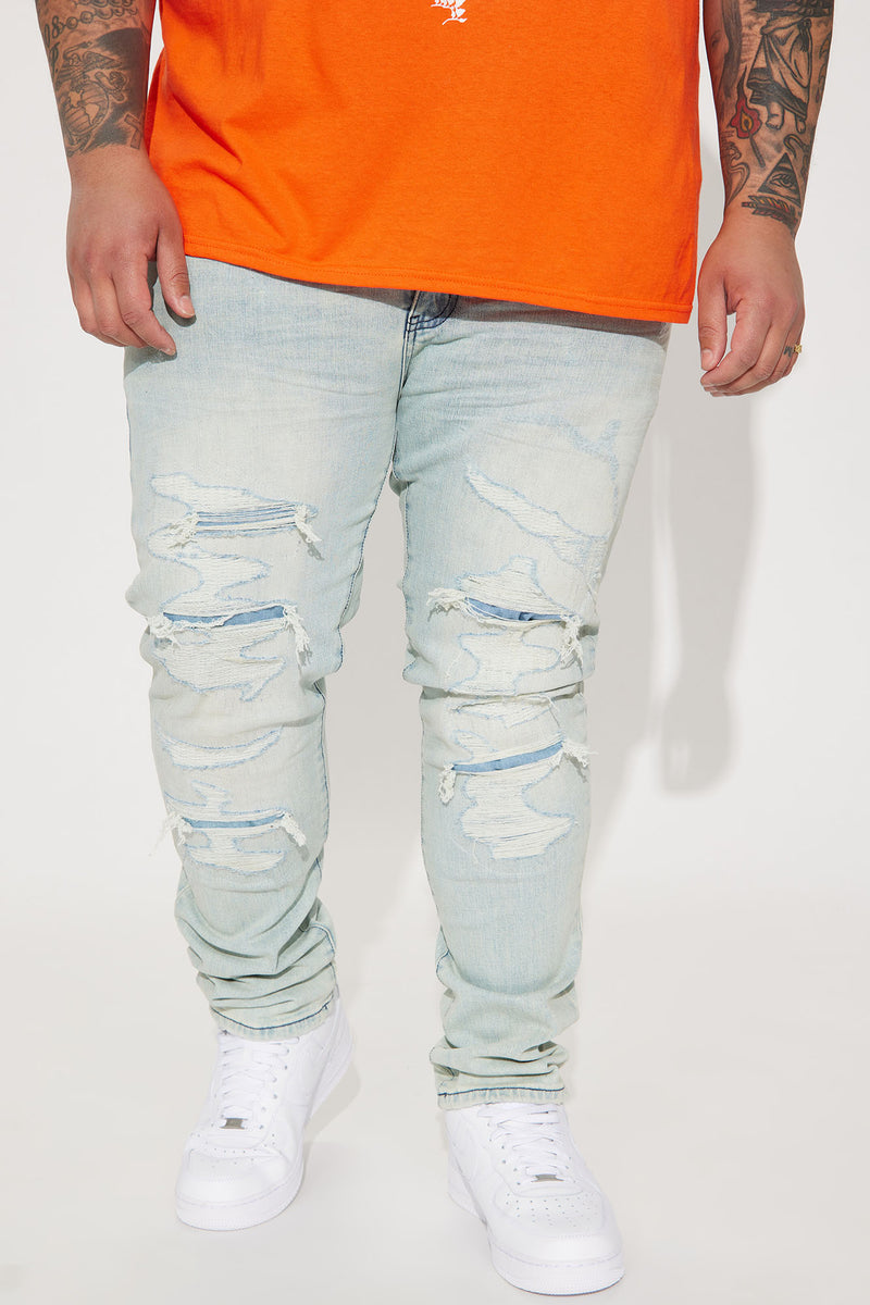 Trying To Chill Ripped Stacked Skinny Jeans Light Wash Fashion Nova