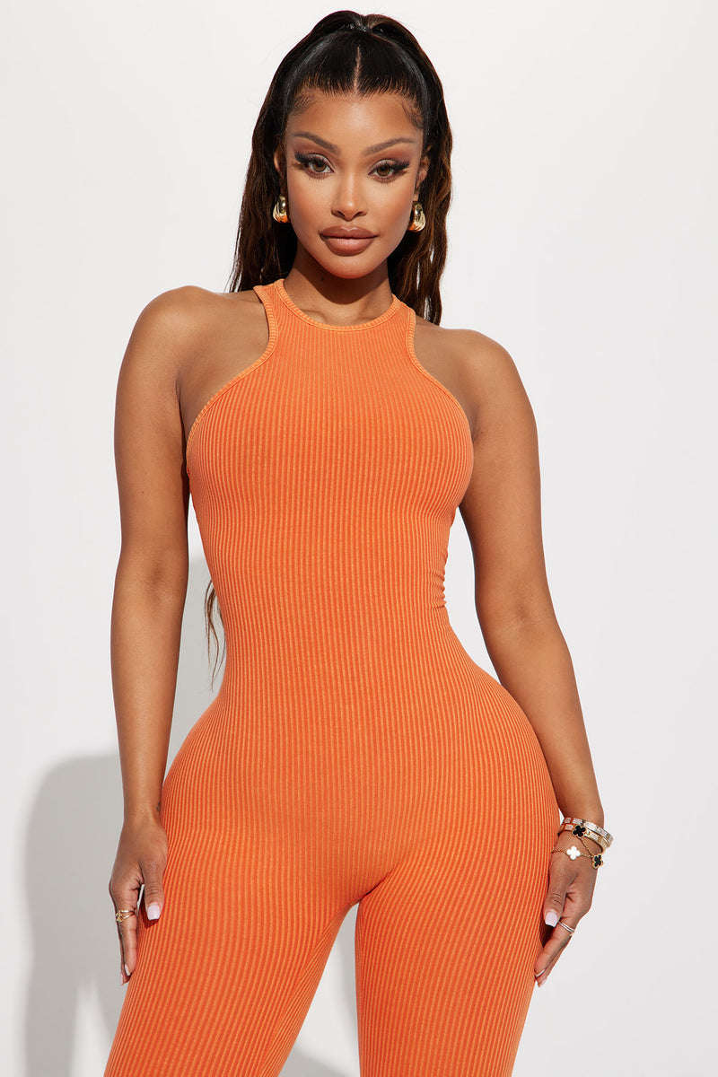 Orange jumpsuit fashion nova sales