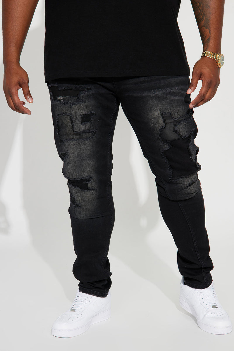 Black ripped stacked skinny jeans 2025