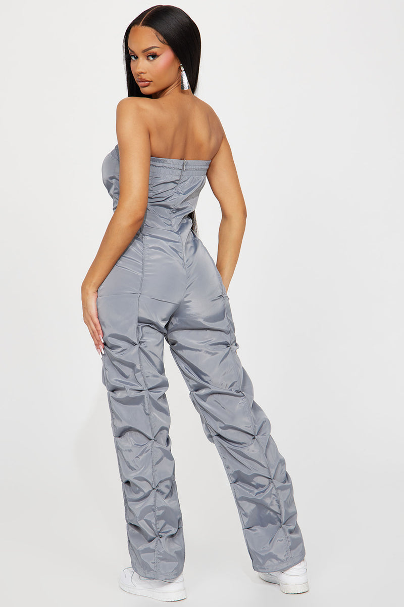 nsw swoosh utility jumpsuit in black