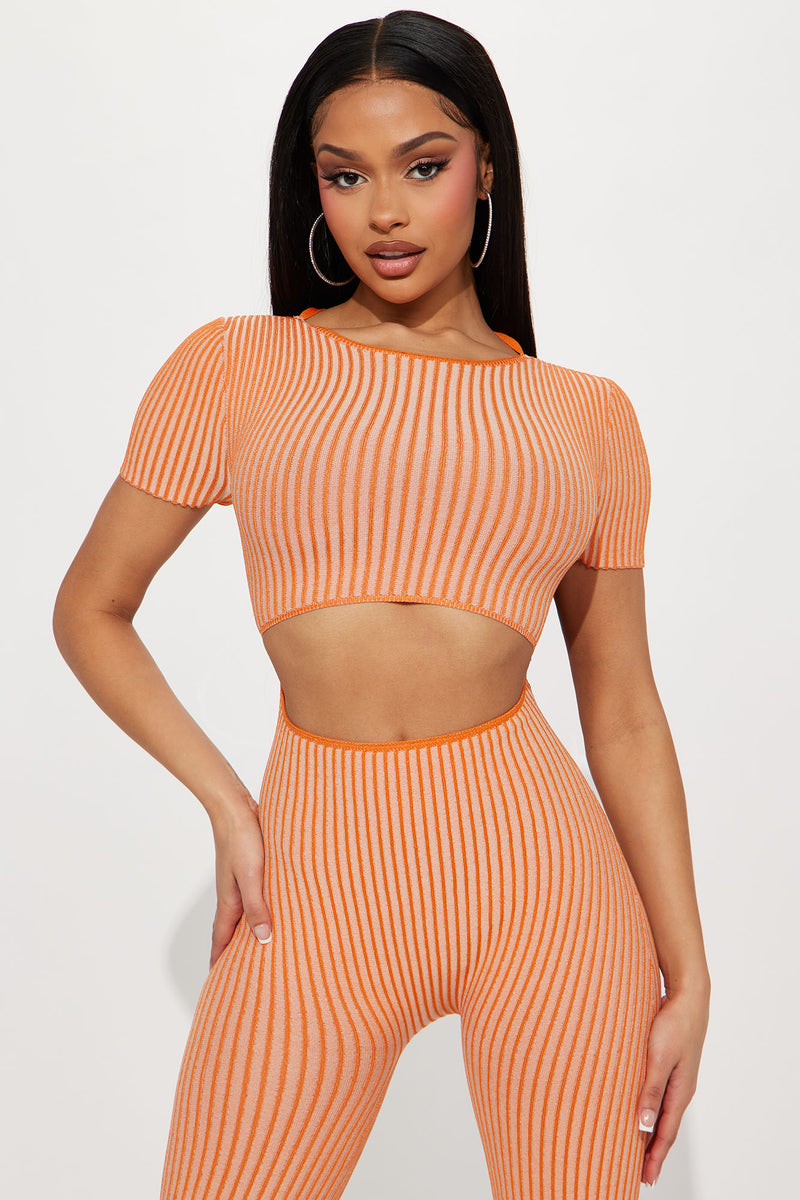 Orange jumpsuit fashion nova deals