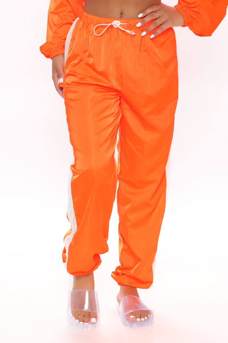 Neon orange track pants discount