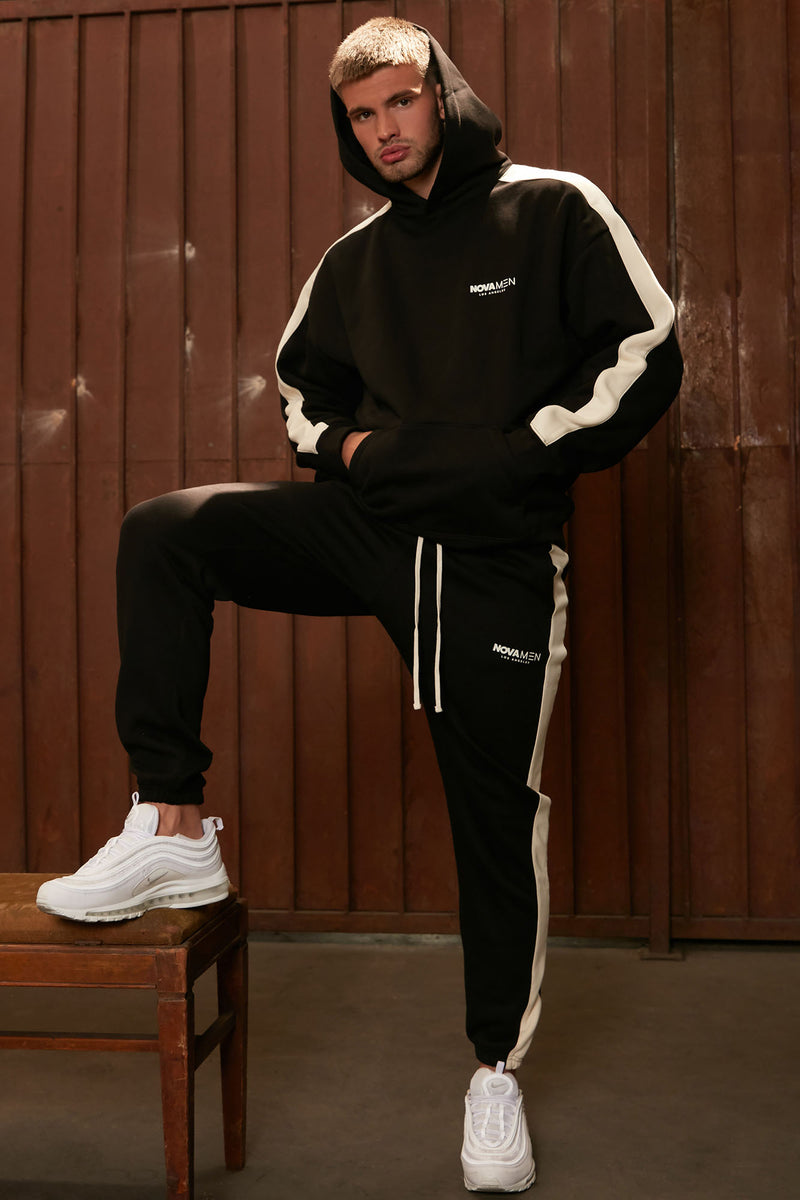 Fear of god essentials outlet side stripe sweatpants black