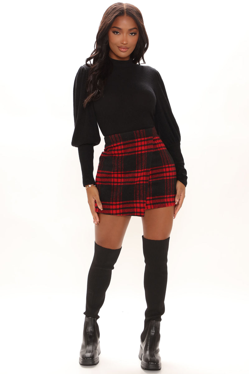 Short red top and black skirt