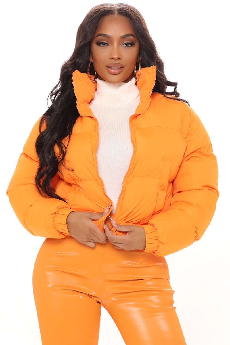 Cropped orange puffer jacket top