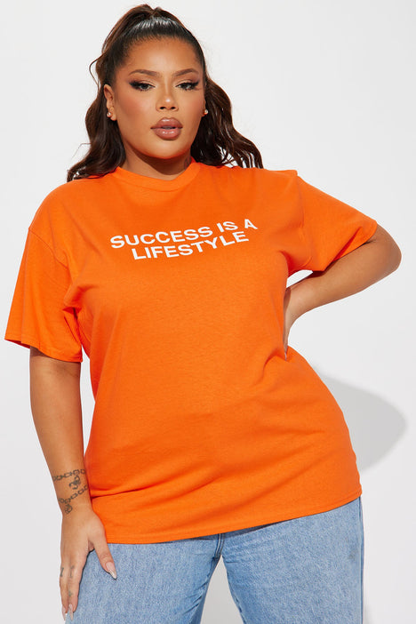 Orange and green graphic 2024 tee