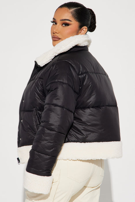 Black puffer jacket with no hood outlet