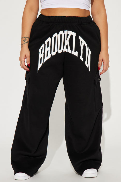 Buy Pineapple Girls Wide Leg Cargo Black Joggers from Next Germany