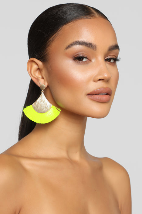Neon yellow tassel earrings top