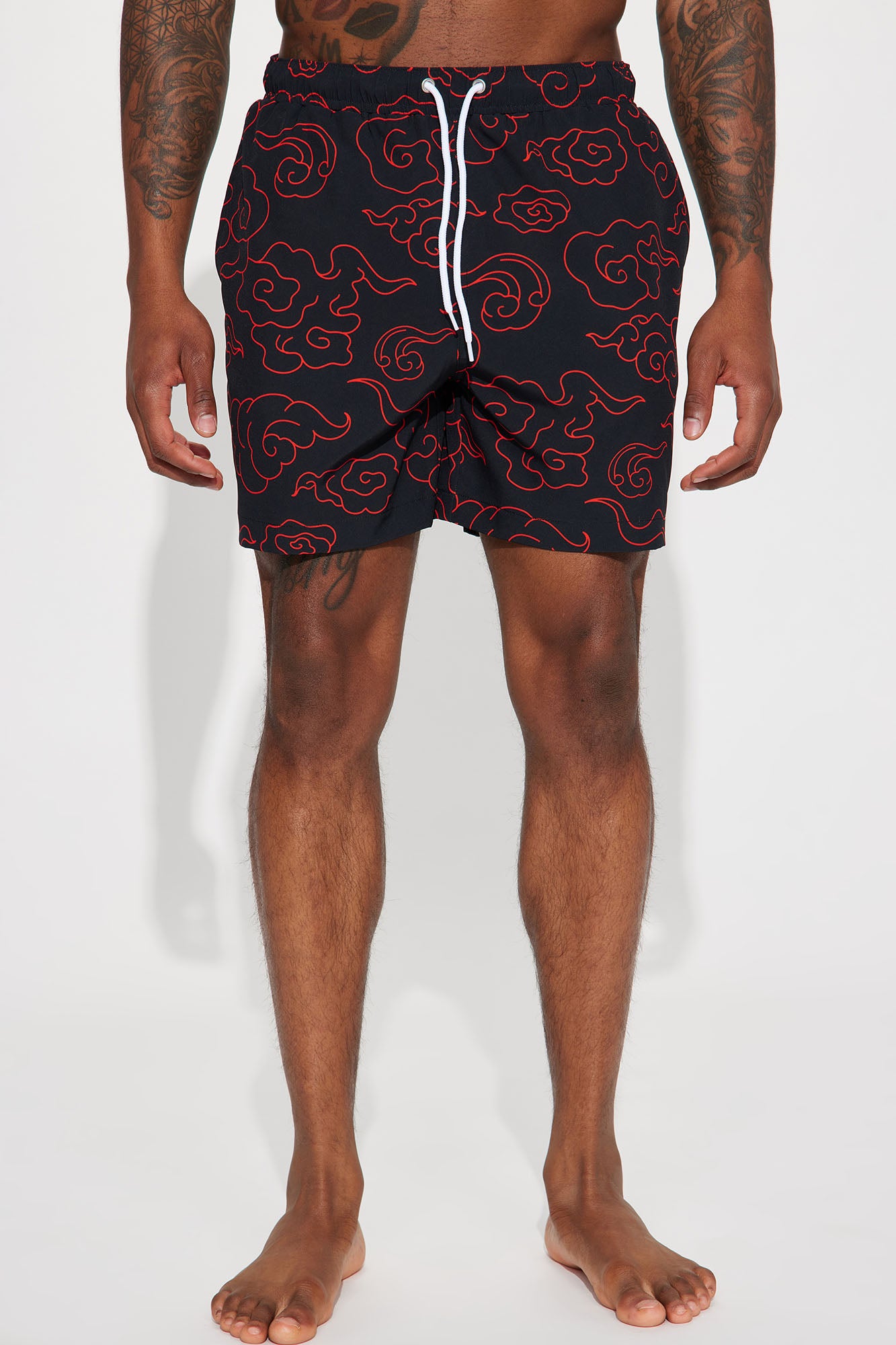 Red and 2025 black swim trunks