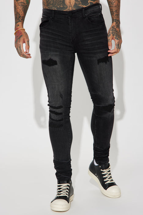 Ripped black sales skinny jeans