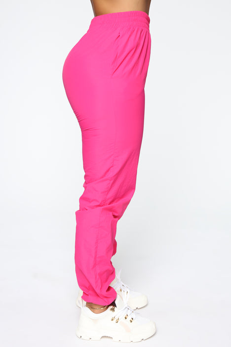 Neon pink windbreaker pants top