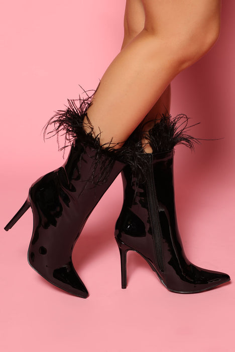 Expensive black top boots