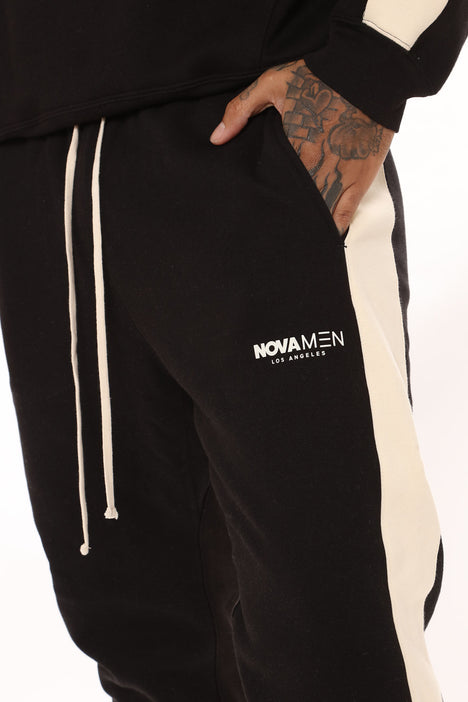 Fear of god essentials side stripe sweatpants black store