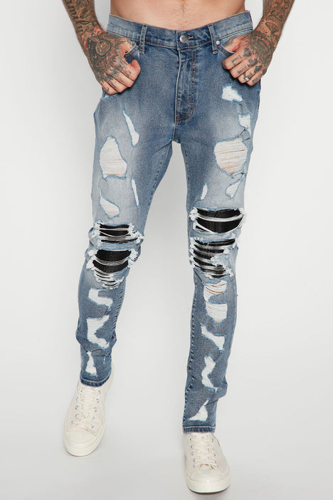 Big ripped skinny jeans hot sale