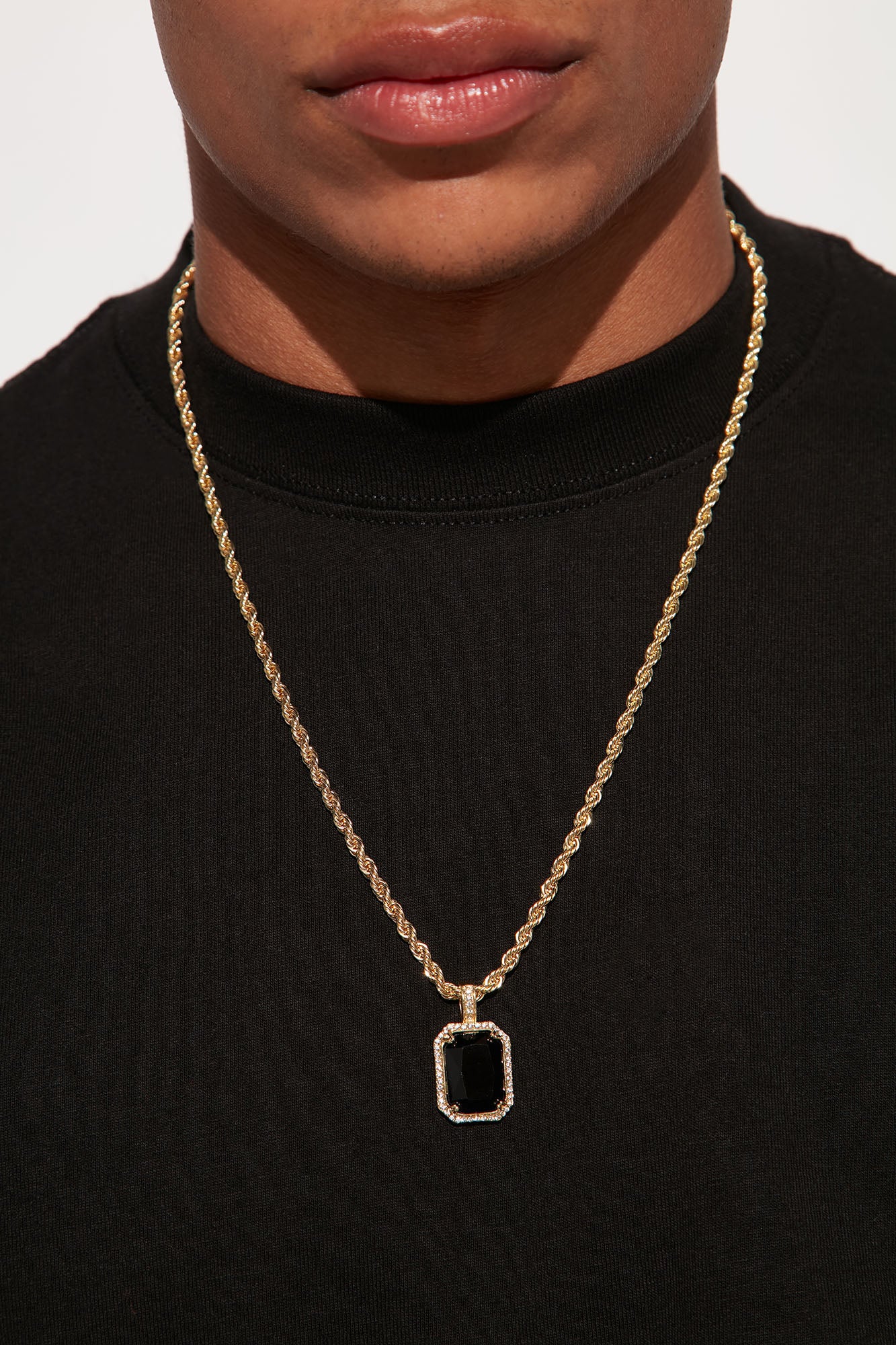 Gold necklace sales with black stone