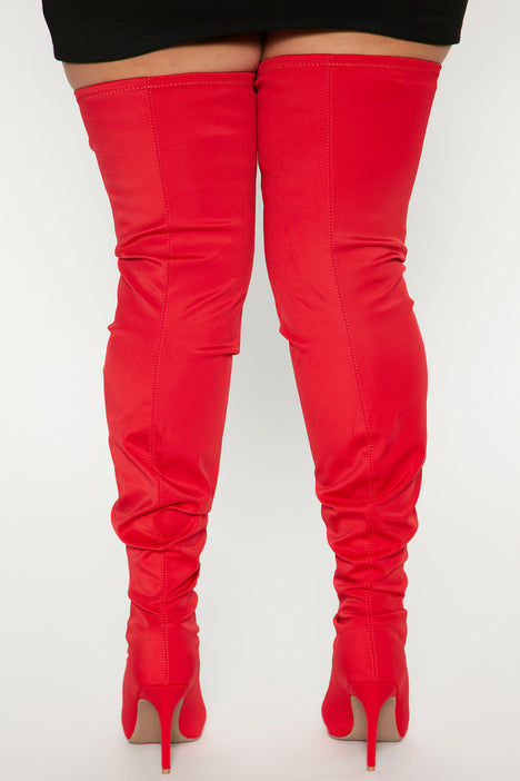 Thigh high top red bottoms