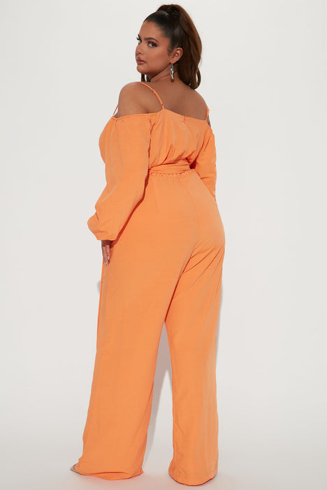 Orange jumpsuit fashion nova sales