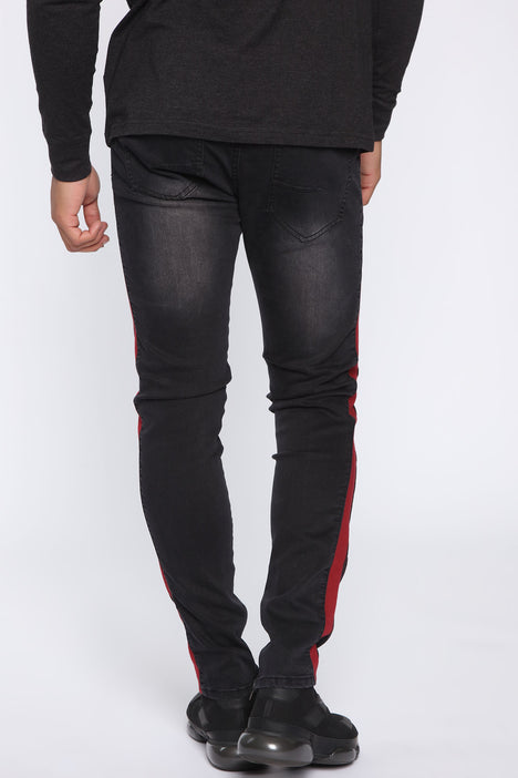 Black jeans store with red stripe