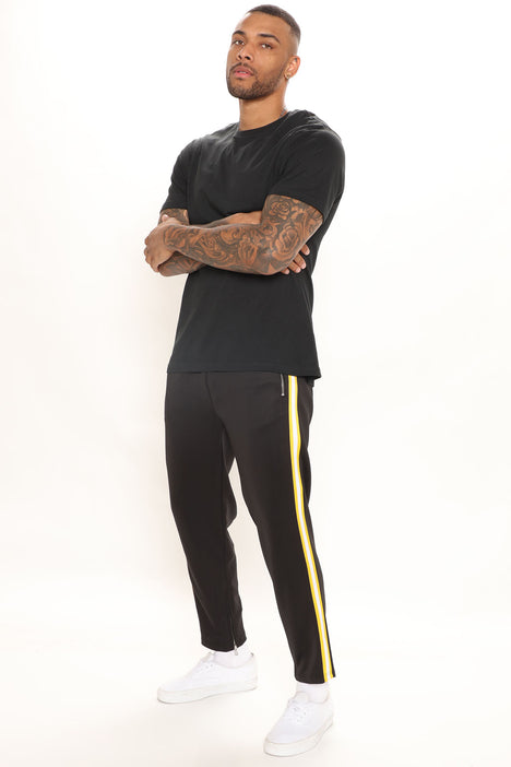 Black pants with on sale yellow side stripe