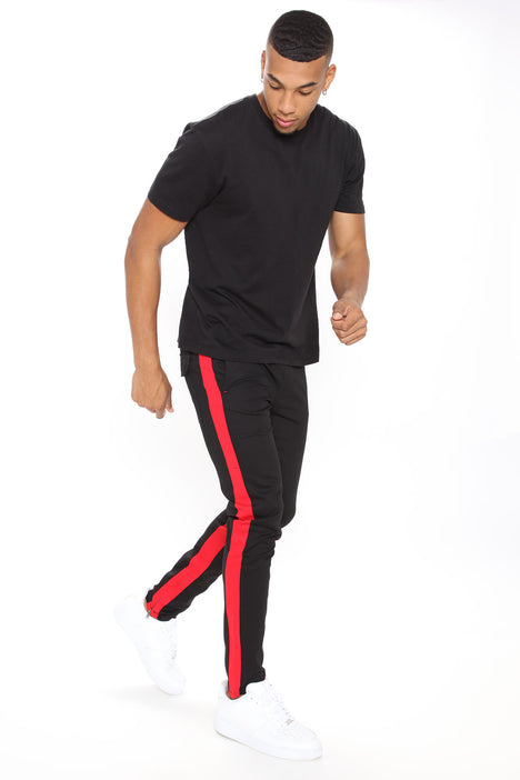 Mens black store and red joggers