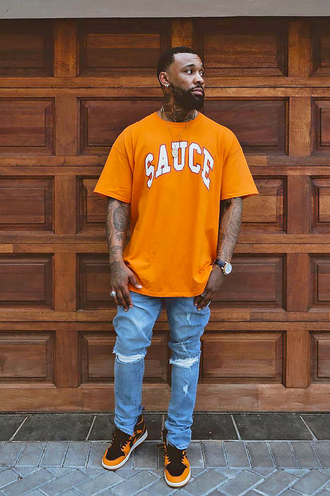 men's white and orange graphic tee